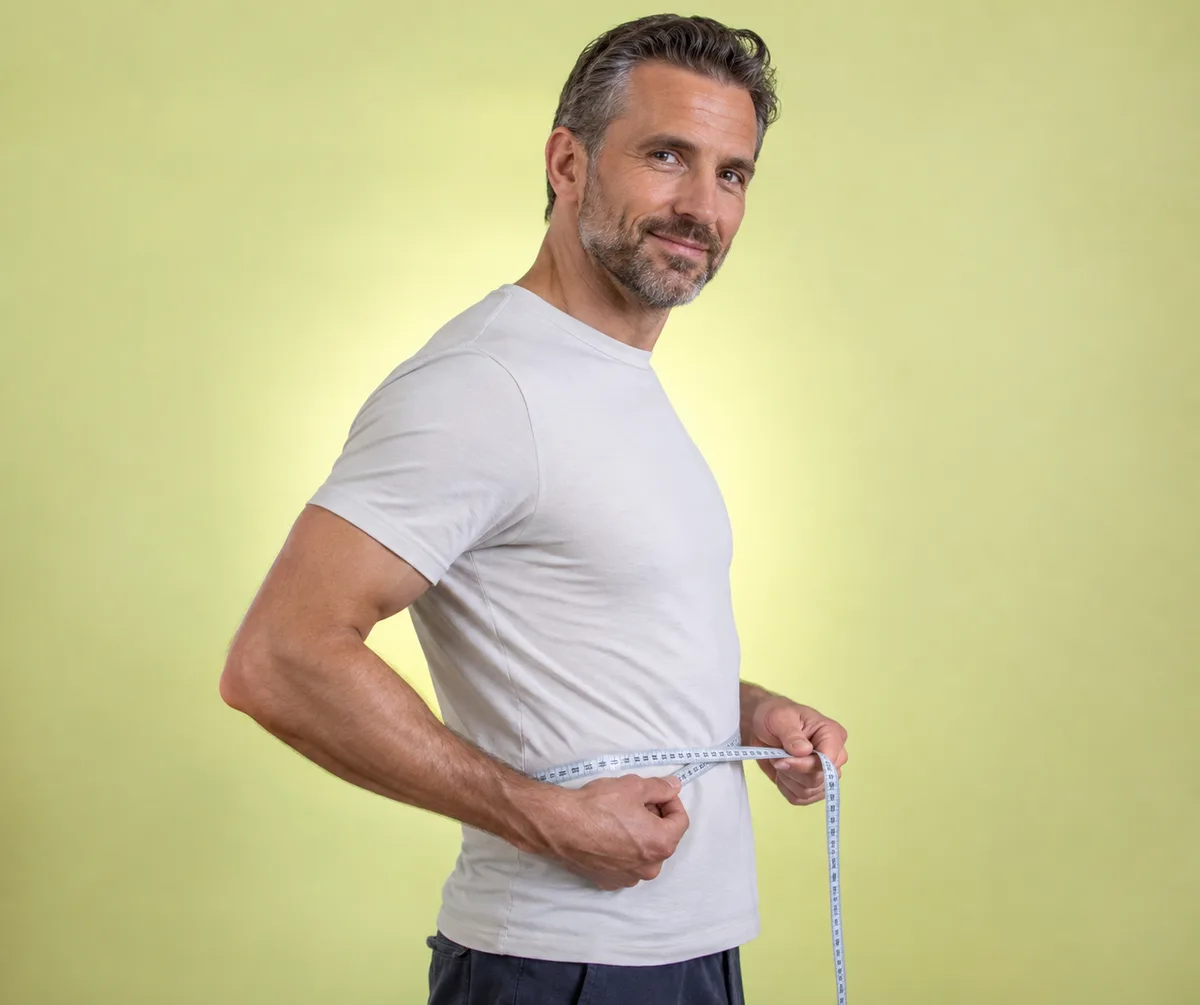 Man measuring his waist
